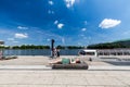 Girl lying on a bench at the Jungfernstieg in Hamburg, Germany