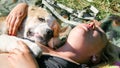 The girl is lying with the dog. Central Asian Shepherd Dog, Alabay Royalty Free Stock Photo