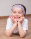 Girl lying on the floor Royalty Free Stock Photo