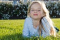 Girl lying in grass