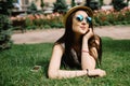 Girl lying on grass and talking on phone Royalty Free Stock Photo