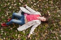 Girl lying on the ground Royalty Free Stock Photo