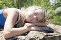 Girl lying on a rock and enjoying
