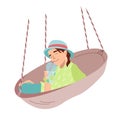 Girl lying in round hammock and drinking refreshing cocktail Young girl holds a glass of tropical drink in her hand and