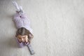 Girl Lying On Rug With Remote Control Royalty Free Stock Photo