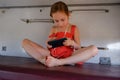 Girl lying on the top shelf in the train.Summer Vacation and Travel Concept. the girl in the train lies on the top shelf