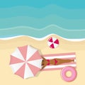 Girl is lying under an pink umbrella on the beach Royalty Free Stock Photo