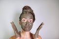 Young girl made a mask of dead sea mud for face and hair