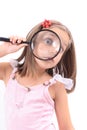 Girl and magnify her face Royalty Free Stock Photo