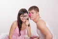 Girl with magnifying glass, guy clown nose Royalty Free Stock Photo