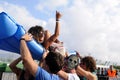 Girl makes body surfing over an inflatable mattress at Los Tiki Phantoms band show at FIB