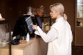 The girl makes a contactless order on an electronic scoreboard in a cafe