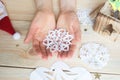 the girl makes a homemade snowflakes cut out of paper, preparation for the new year, Christmas Royalty Free Stock Photo