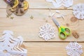 The girl makes a homemade snowflakes cut out of paper, preparation for the new year, Christmas Royalty Free Stock Photo