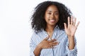 Girl makes promise. Portrait friendly-looking sincere cute african-american woman telling truth raise one hand put arm