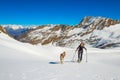 Girl makes ski mountaineering with dog