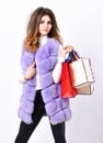 Girl makeup furry violet vest shopping white background. Shopping and gifts. Woman shopping luxury boutique. Lady hold Royalty Free Stock Photo