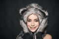 Girl with makeup wears fluffy fur hat with ears like cat. Cute kitty outfit. Carnival and Halloween ideas. Cute outfit Royalty Free Stock Photo