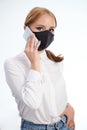 Girl making call wearing face mask Royalty Free Stock Photo