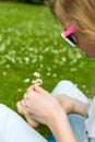 Girl making a daisy chain Royalty Free Stock Photo