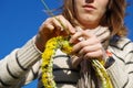 Girl making flower daisy chain Royalty Free Stock Photo