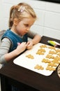 Girl making gingerbread cookies for Christmas Royalty Free Stock Photo