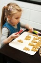 Girl making gingerbread cookies for Christmas Royalty Free Stock Photo