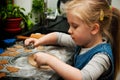 Girl making gingerbread cookies for Christmas Royalty Free Stock Photo