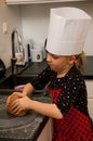 Girl making gingerbread cookies