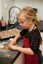 Girl making gingerbread cookies