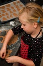 Girl making gingerbread cookies