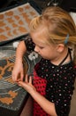 Girl making gingerbread cookies