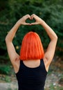 Girl making a heart shape symbol Royalty Free Stock Photo