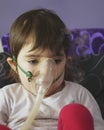 Girl making inhalation with mask on her face Royalty Free Stock Photo