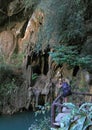Girl is making photo of cave in Than Bok Khorani National Park
