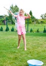 Girl making soap bubbles in home garden Royalty Free Stock Photo