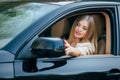 Girl making up into a car. Royalty Free Stock Photo