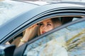 Girl making up into a car. Royalty Free Stock Photo