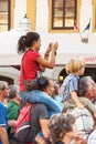 Girl on man's shoulders during Spancirfest festival