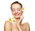 Girl with many camomile flowers Royalty Free Stock Photo