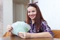 Girl with many euro in home