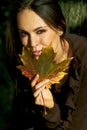 Girl and maple leave Royalty Free Stock Photo