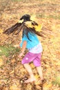 Girl with maple leaves twisting