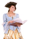 Girl in marquise dress and hat read book.