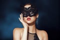 The girl in the mask. Masquerade, halloween. Girl in a cat mask. Catwoman on a beautiful background in a beautiful lace top with Royalty Free Stock Photo
