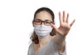 A girl in a mask shows a stop gesture fearing for the health of people