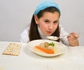 Girl matzo ball soup Royalty Free Stock Photo