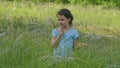 Girl in a meadow in summer hobbling slow motion video