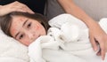 Girl With Measles Virus Lying On Mother Knees