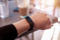 Girl measures her heart rate with a smart bracelet